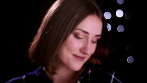 Closeup shoot with blurr effect of young pretty short haired female smiling with Video stock 106999655