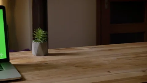 Closeup shoot by camera moving around of the laptop with green chroma key screen 動画素材 104916646