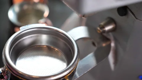 Closeup shoot of coffee beans being freshly grounded in a coffee blending Video stock 107656845
