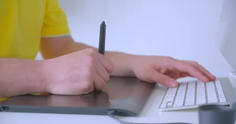 Closeup shoot of designer hands typing on the graphic touchpad indoors in the Video stock 111378970