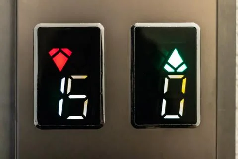 A closeup shoot of elevator signs with up and down arrows and numbers Stock Photos