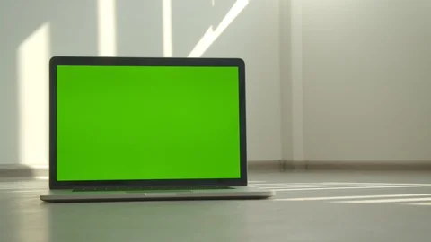 Closeup shoot of laptop with green screen laying on the table in the office Video stock 110211334