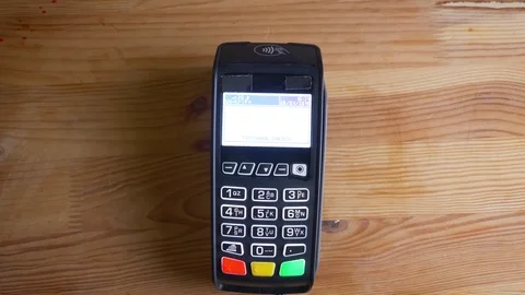 Closeup shoot of a payment terminal being used for the online shopping indoors Video stock 105714109