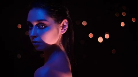 Closeup shoot of pretty female with stunning glitter makeup with pink and yellow Stock Footage 106934349