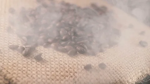 Closeup shoot of roasted steamy coffee beans, turntable Stock-Footage 106418951