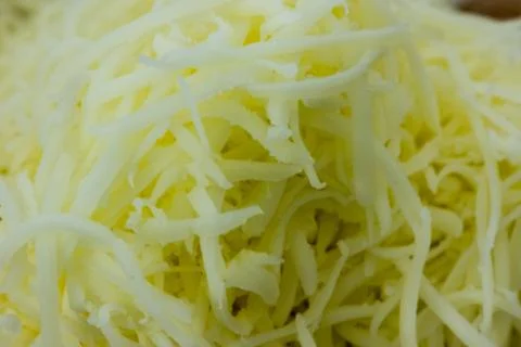 Closeup shoot of the shradded cheese Stock Photos