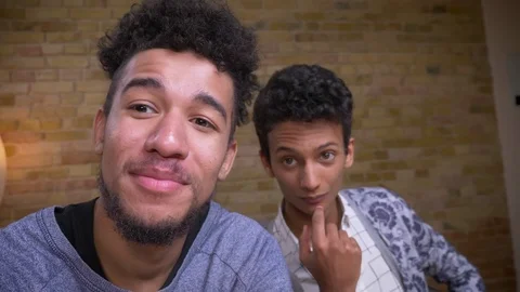 Closeup shoot of two young african american and indian male bloggers streaming Stock Footage 108509832