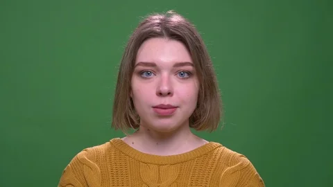 Closeup shoot of young attractive short haired female smiling happily looking at Stock Footage 108686372