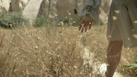 Closeup shoot of young female traveler in dress hiking and walking on the stone Stock Footage