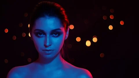 Closeup shoot of young pretty caucasian female with stunning makeup with blue Stock Footage 106932186