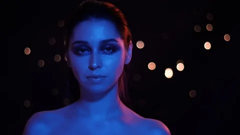 Closeup shoot of young pretty caucasian female with stunning glitter makeup with Video stock 106932710