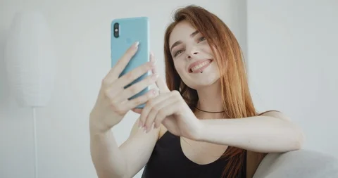 Closeup shoot of young seductive caucasian female in black bodysuit taking Video stock 111963035