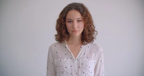 Closeup shoot of young stylish long haired curly caucasian female smiling Stock-Footage 109803005