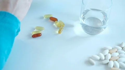 Closeup shooting on pills pack on table of ill woman kitchen Stock Footage 74323258