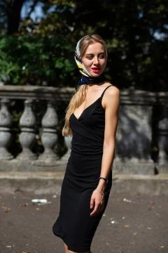 Closeup shot of attractive model with red lips wearing shawl and black dress  Stock Photos