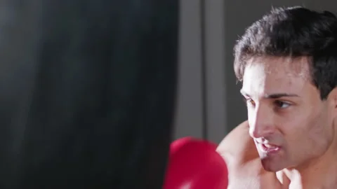 Closeup shot of attractive young man boxing in gym Stock Footage 181834530