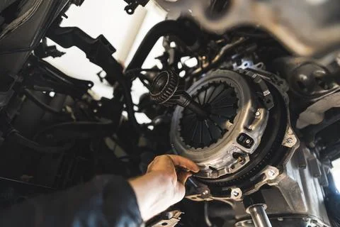 Closeup shot of an auto mechanic installing a new clutch kit for a car, auto Stock Photos