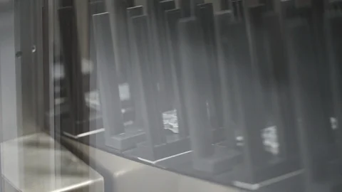 Closeup shot of an automated pill packaging blister machine conveyor. Stock Footage 119928326