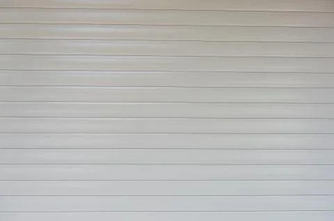 A closeup shot of automatic metal roller door used in factory, storage, garag Stock Photos