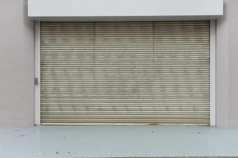 A closeup shot of automatic metal roller door used in factory, storage, garag Stock Photos