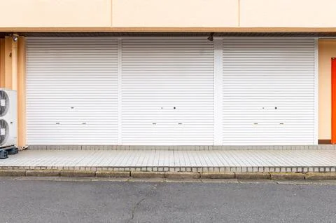 A closeup shot of automatic metal roller door used in factory, storage, gar.. Foto stock