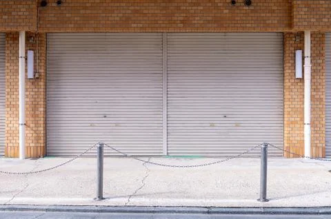 A closeup shot of automatic metal roller door used in factory, storage, gar.. Stock-Fotos