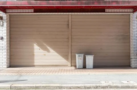 A closeup shot of automatic metal roller door used in factory, storage, gar.. Stock-Fotos