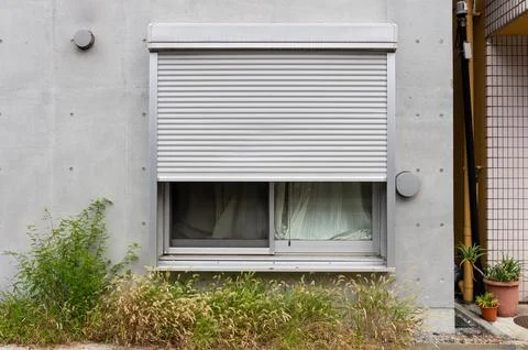 A closeup shot of automatic metal roller door used in factory, storage, gar.. Foto stock