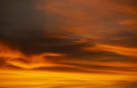 Closeup shot of a beautiful dramatic orange sky at sunset Stock Photos