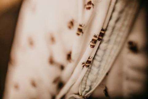 Closeup shot of a bee pattern on a textile Stock Photos