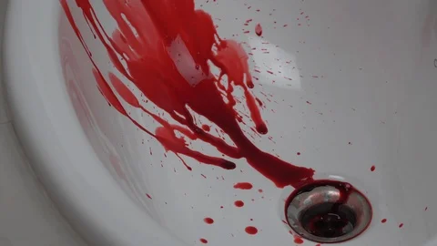 Closeup shot of blood dripping into sink. Stock Footage