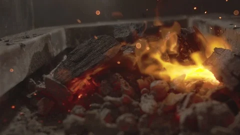 Closeup shot of bonfire with coals and beautiful yellow sparks Stock Footage 114551646