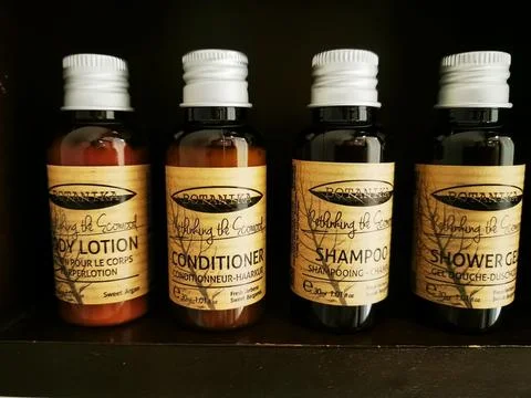 A closeup shot of Botanika brand products. The body lation, conditioner, shampoo Stock Photos