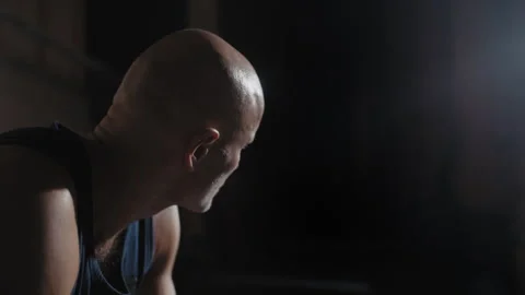 Closeup shot of a boxer resting on a bench after training Stock Footage 258232930