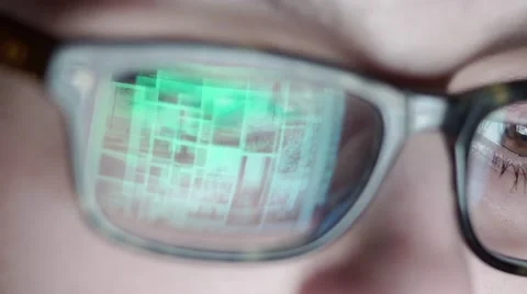 Closeup shot of boy in glasses surfing internet at night Stock Footage 59042729