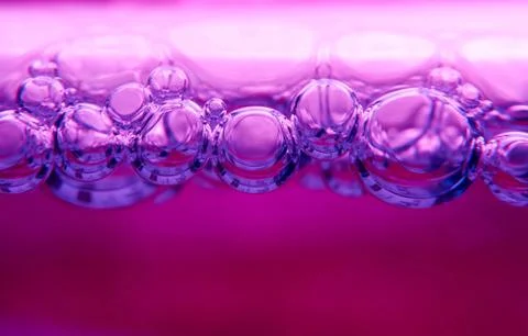Closeup shot of bubbles on a pink background Foto stock