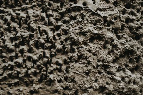 Closeup shot of bumpy rough stone texture Stock Photos