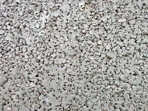 Closeup shot of the bumpy surface ocement gravel Stock Photos