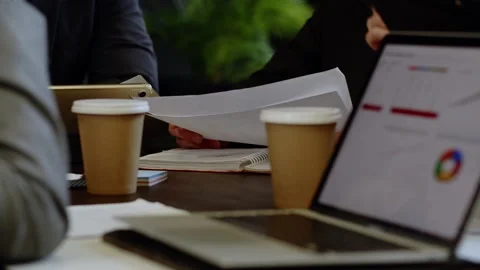 Closeup shot of businessman reading documents actual information about market Stock Footage 256215710
