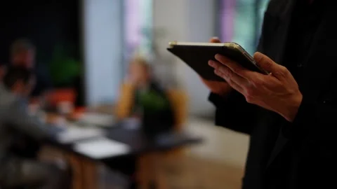 Closeup shot of businessman using tablet. Man browsing fresh data about Stock Footage 251566912