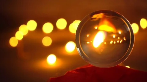 Closeup shot of a candle inside a crystal ball Stock Footage 97379420