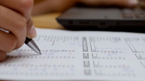 Closeup shot of a chartered accountant checking company balance sheet Stock Footage 114542842