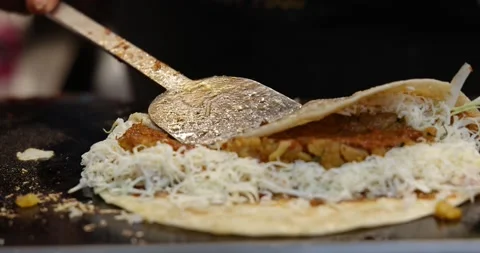 Closeup shot of a chef making Vegetable Frankie Wrap Roll Indian stlye Stock Footage 169833790