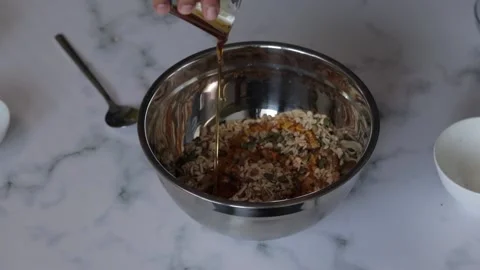 A closeup shot of a chef preparing an oat and nut mixture for breakfast grano Stock Footage 139259989