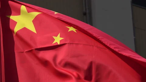 Closeup shot of the Chinese flag waving in wind. 4K Stock Footage 131136844