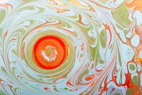 Closeup shot of a circular orange shape surrounded by green patterns Stock Illustration