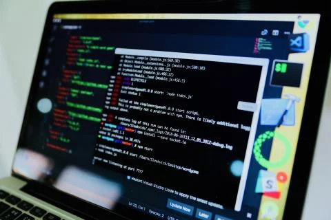 Closeup shot of coding on a laptop computer displaying a command prompt Stock Photos