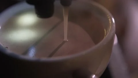Closeup shot of coffee machine makes espresso in a white cup Stock Footage 137603135