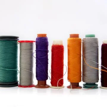 Closeup shot of colorful thread spools Stock Photos