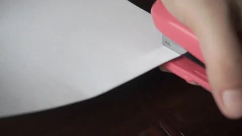Closeup shot Compiling bond papers with stapler Stock Footage 112655387